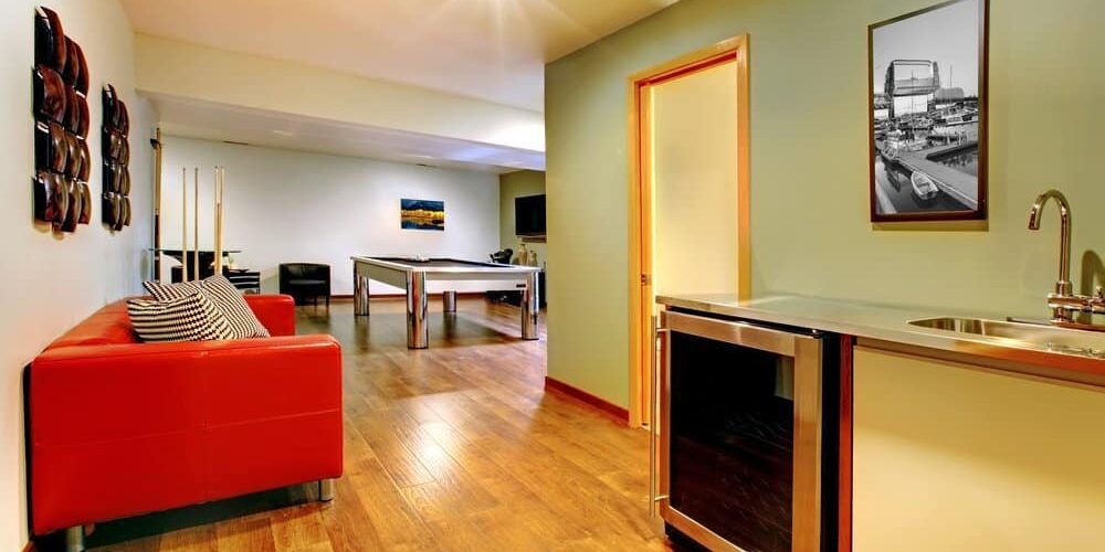 game-room cozy basement game room with couch kitchenette and pool table