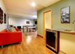 cozy basement game room with couch kitchenette and pool table