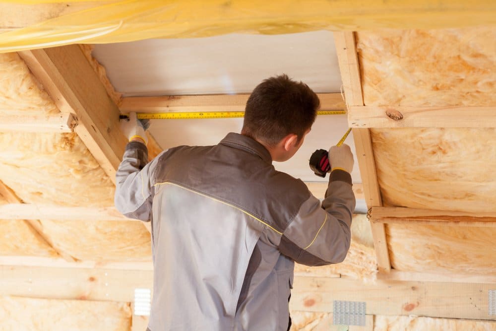 man fixing structural issue in his home to increase its value