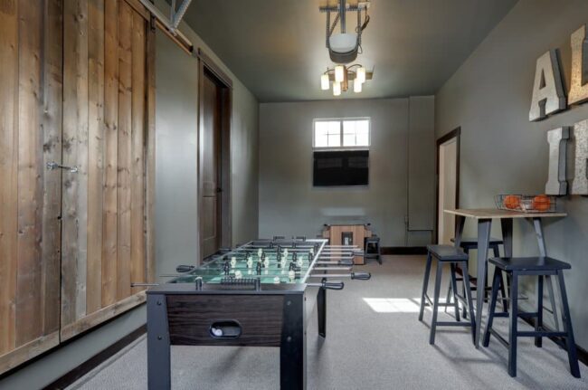 Modern,Garage,Interior,With,Fun,Family,Play,Room,With,Hockey Garage Addition Services Fort Collins CO