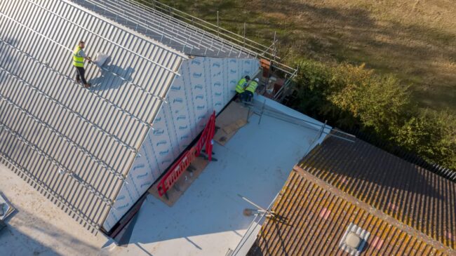 Aerial view of a construction site of a school in East London, UK Roofing Company Fort Collins CO